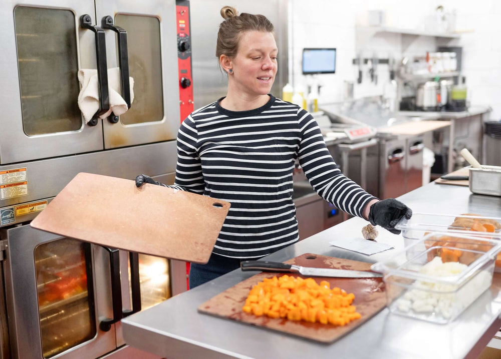 Chef Erin Palombo using with an Epicurean Kitchen Series Cutting Board