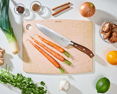 Epicurean Kitchen Series Cutting Board in Natural with fruits and vegetables ready to be sliced with a Victorinox Chef's Knife