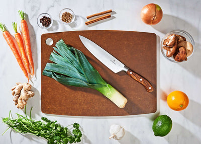 Epicurean Kitchen Series in Nutmeg with fruits and vegetables ready to be sliced with a Victorinox Chef's Knife