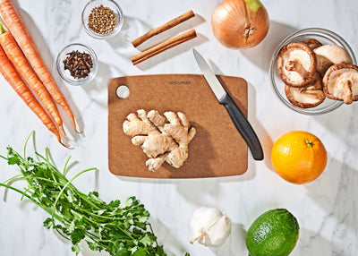 Kitchen Series Cutting Board in Nutmeg with fruits and vegetables ready to be sliced with a Victorinox Swiss Classic Paring Knife
